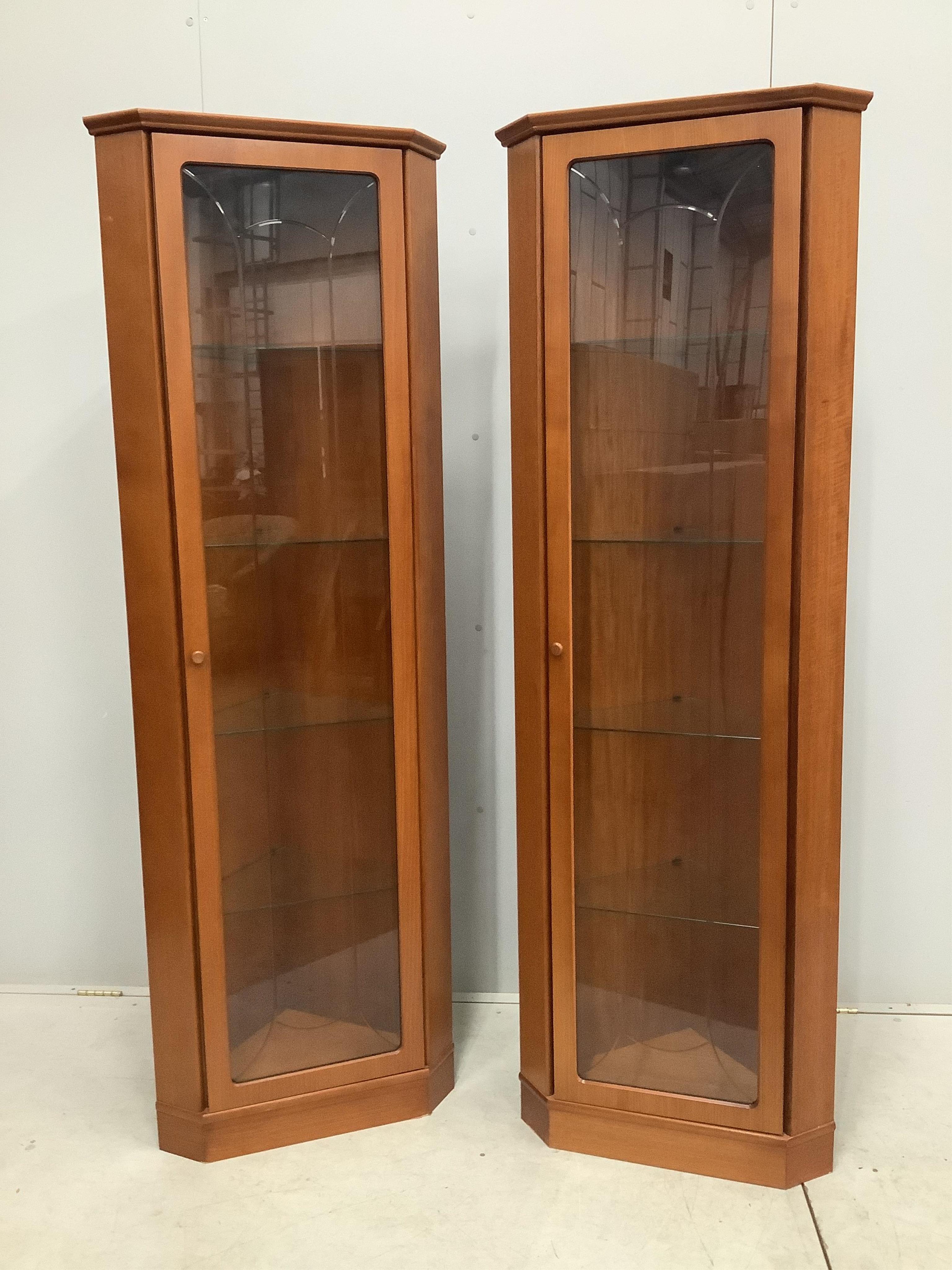 A pair of mid century G Plan teak corner cabinets, width 61cm, depth 39cm, height 185cm. Condition - good